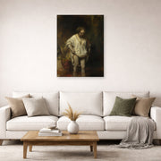 Unframed poster print of Rembrandt's Bathing Girl displayed on a wall in a living room
