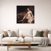 Unframed poster print of Rembrandt's Bathsheba at Her Bath displayed on a wall in a living room
