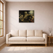 Unframed poster print of Rembrandt's Belshazzars Feast displayed on a wall in a living room