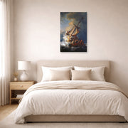 Unframed poster print of Rembrandt's Christ in the Storm on the Lake of Galilee displayed on a wall in a bedroom