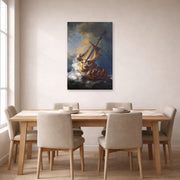 Unframed poster print of Rembrandt's Christ in the Storm on the Lake of Galilee displayed on a wall in a dining room