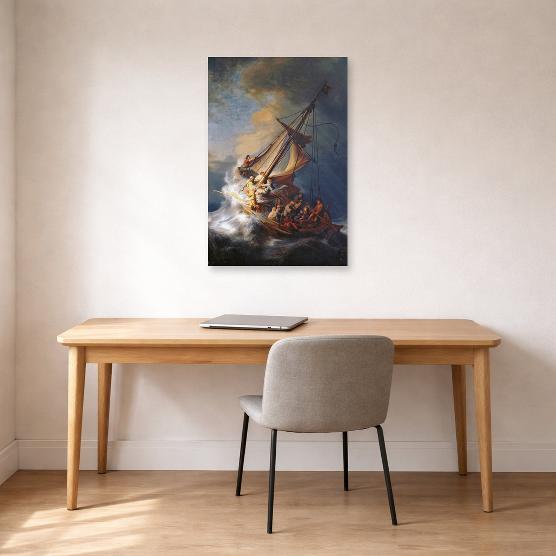 Unframed poster print of Rembrandt's Christ in the Storm on the Lake of Galilee displayed on a wall in an office