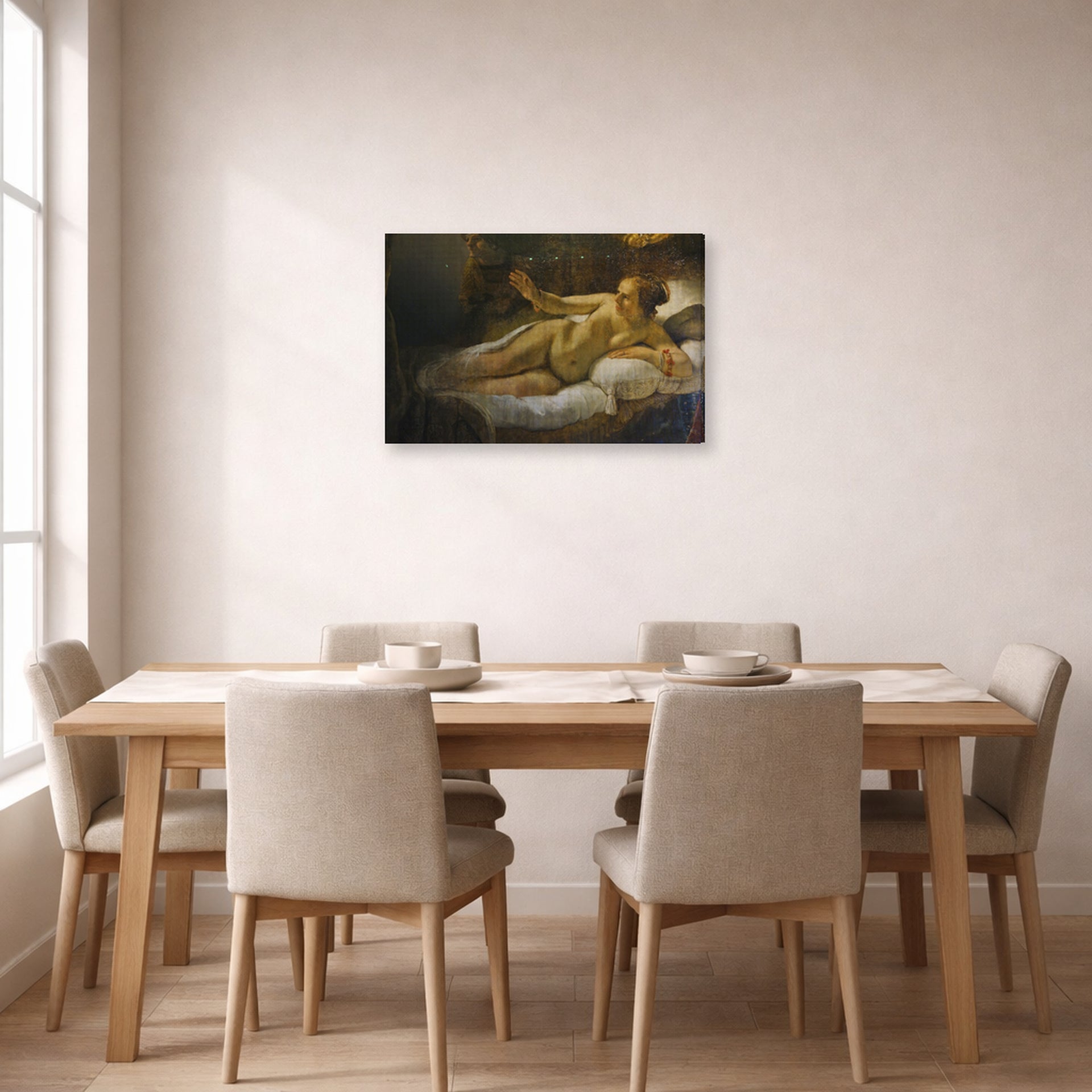 Gallery-wrapped canvas print of Rembrandt's Danaë displayed on a wall in a dining room