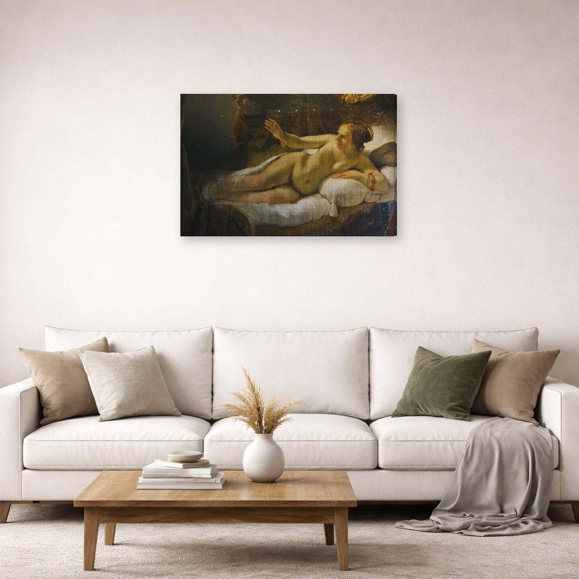 Gallery-wrapped canvas print of Rembrandt's Danaë displayed on a wall in a living room