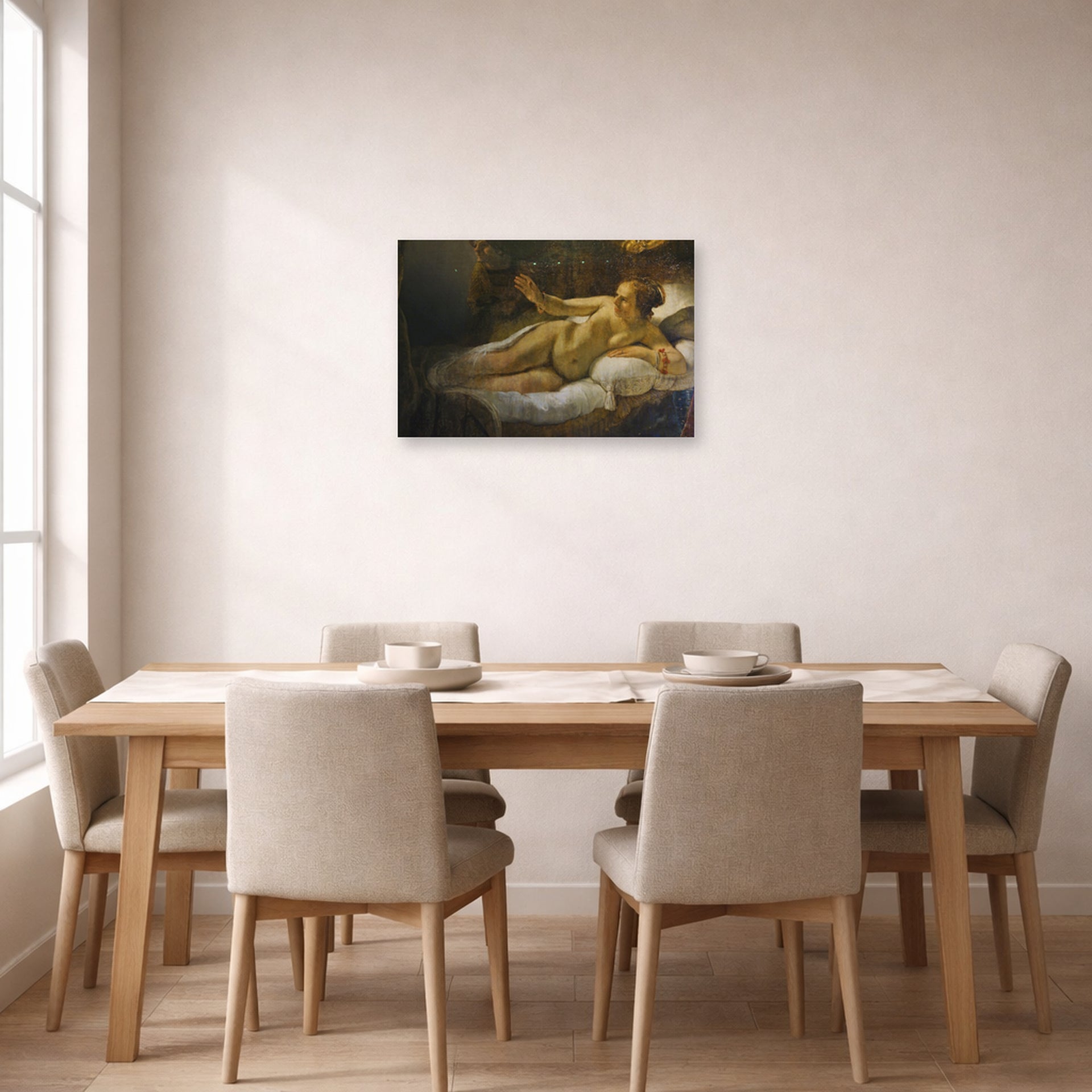 Unframed poster print of Rembrandt's Danaë displayed on a wall in a dining room