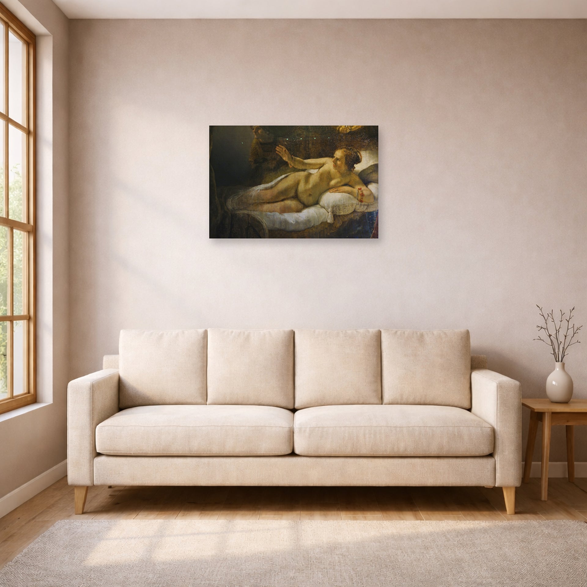 Unframed poster print of Rembrandt's Danaë displayed on a wall in a living room