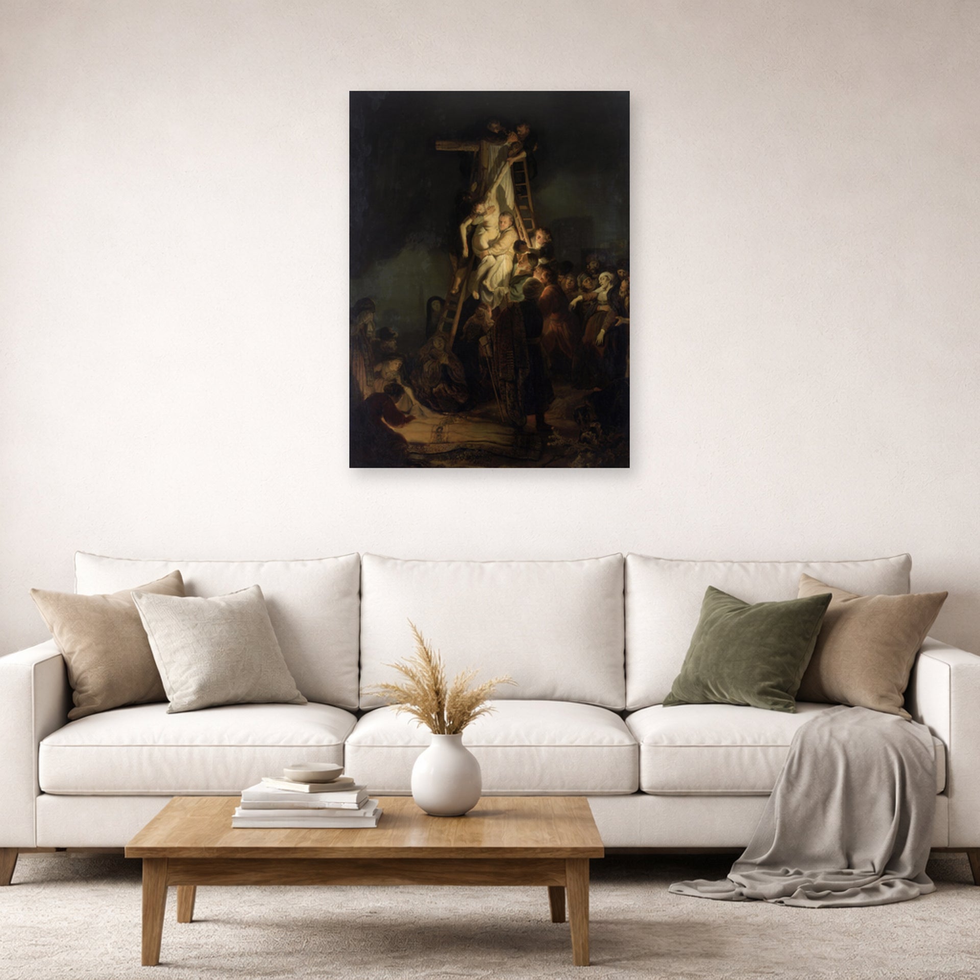 Unframed poster print of Rembrandt's Descent from the Cross displayed on a wall in a living room