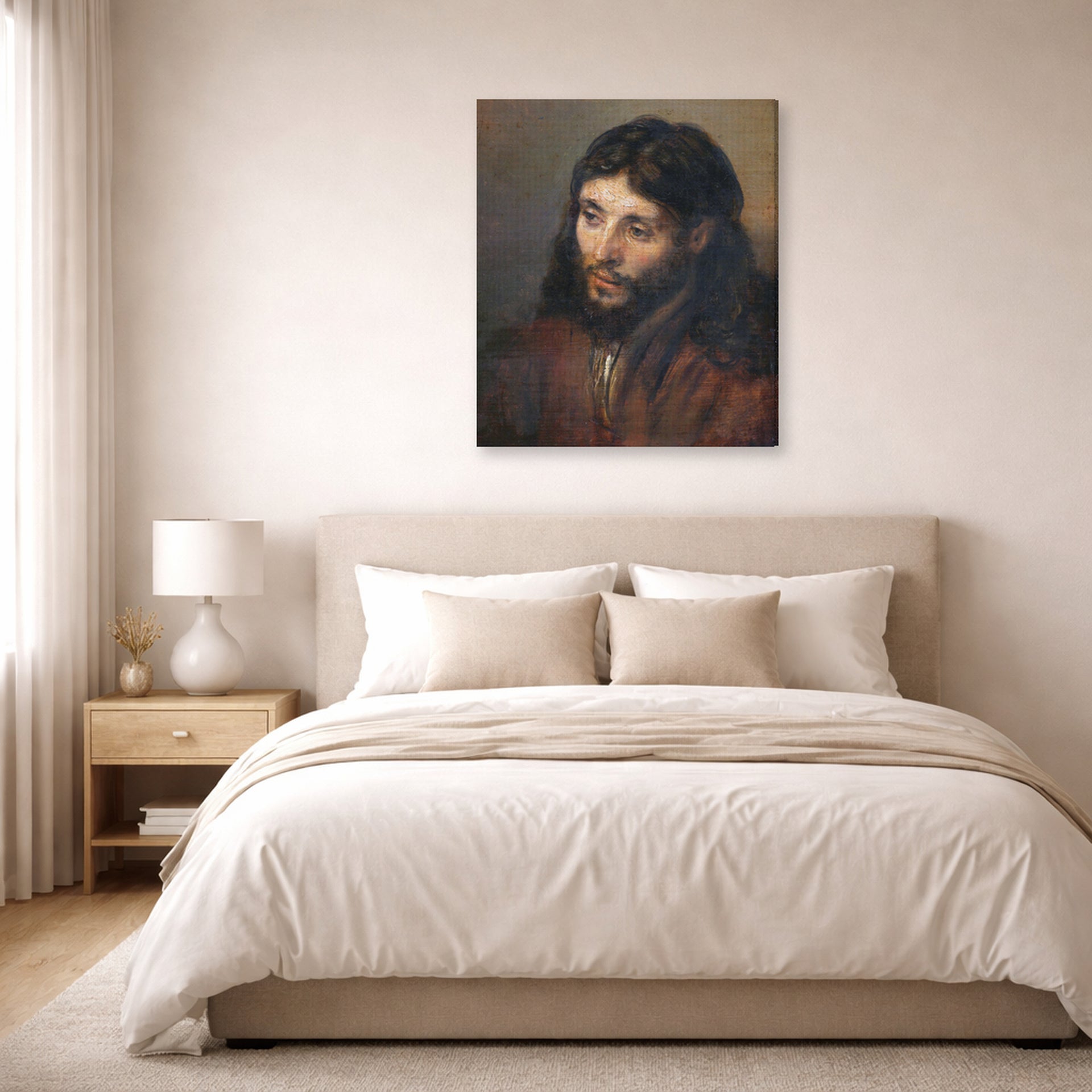 Gallery-wrapped canvas print of Rembrandt's Head of Christ displayed on a wall in a bedroom