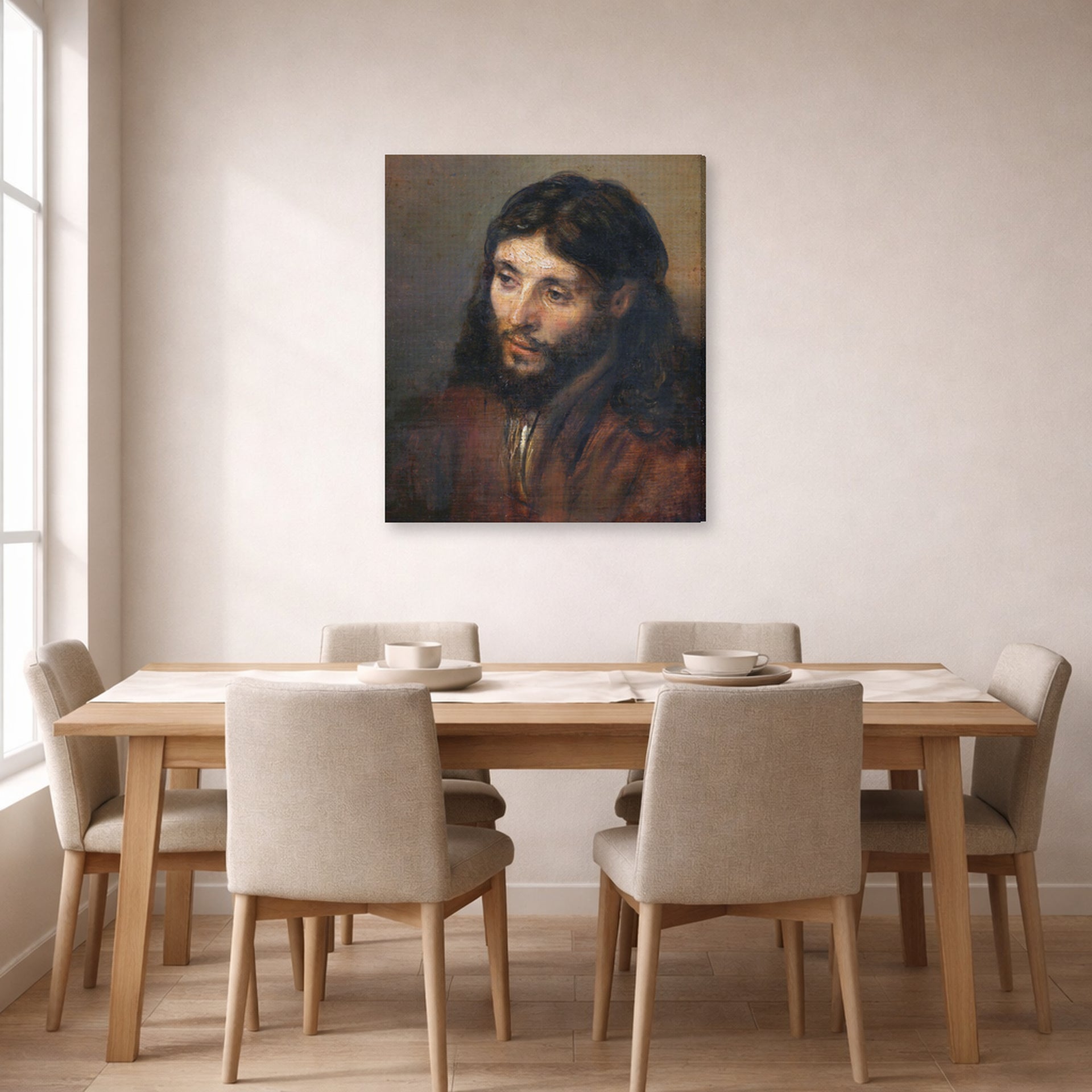 Gallery-wrapped canvas print of Rembrandt's Head of Christ displayed on a wall in a dining room