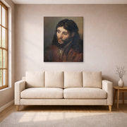 Gallery-wrapped canvas print of Rembrandt's Head of Christ displayed on a wall in a living room