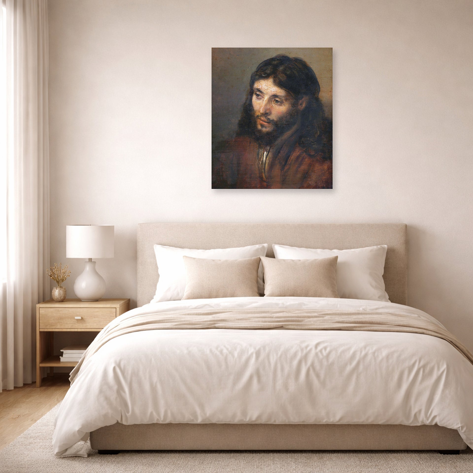 Unframed poster print of Rembrandt's Head of Christ displayed on a wall in a bedroom