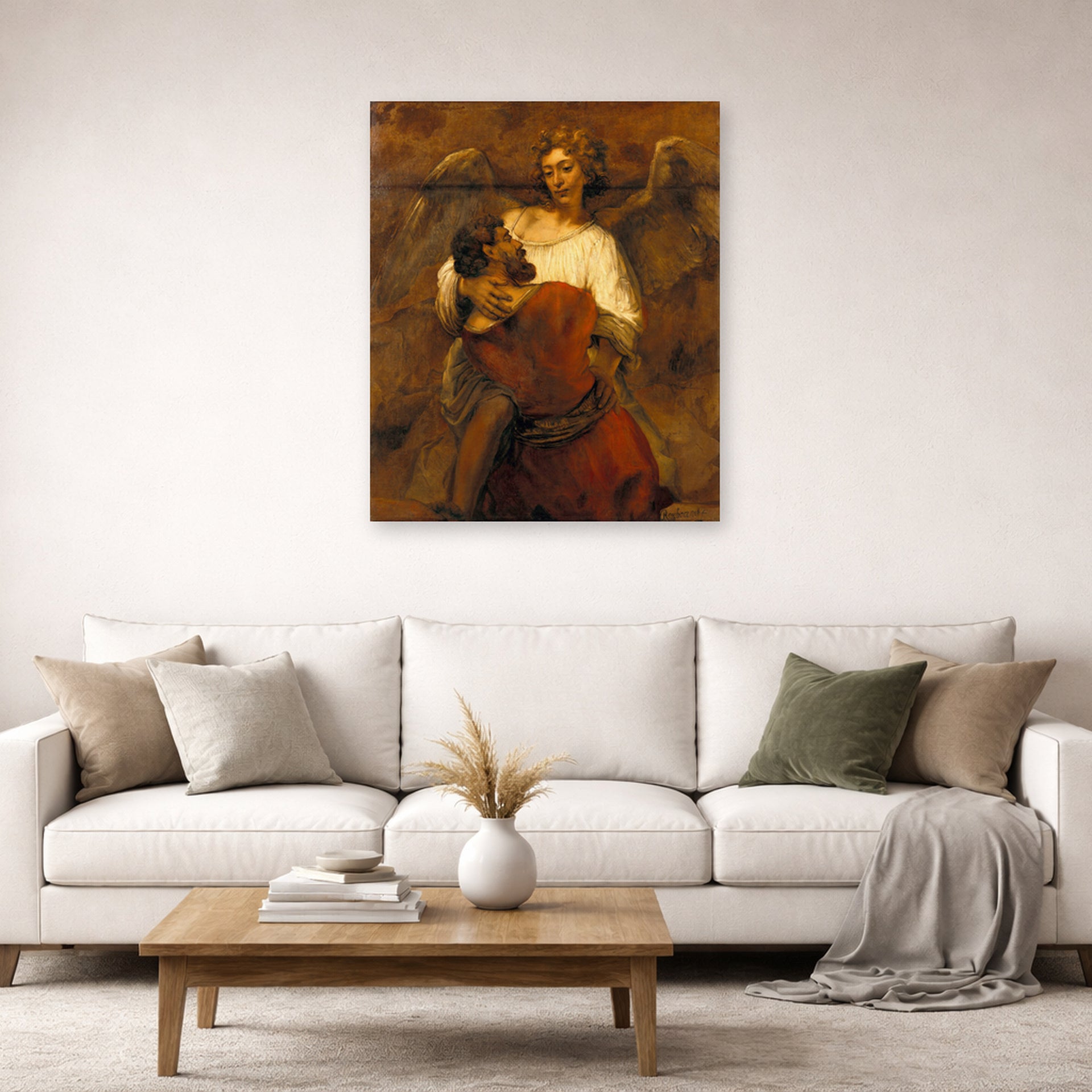 Unframed poster print of Rembrandt's Jacob Wrestling with the Angel displayed on a wall in a living room