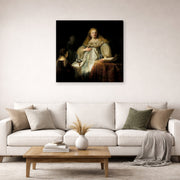 Gallery-wrapped canvas print of Rembrandt's Judith at the Banquet of Holofernes (artemisia) displayed on a wall in a living room