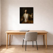Unframed poster print of Rembrandt's Lucretia displayed on a wall in an office