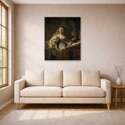 Unframed poster print of Rembrandt's Minerva in Her Study displayed on a wall in a living room