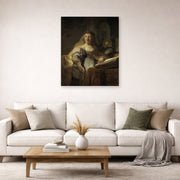 Unframed poster print of Rembrandt's Minerva in Her Study displayed on a wall in a living room