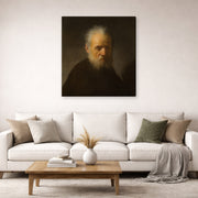 Gallery-wrapped canvas print of Rembrandt's Old Man with Beard displayed on a wall in a living room