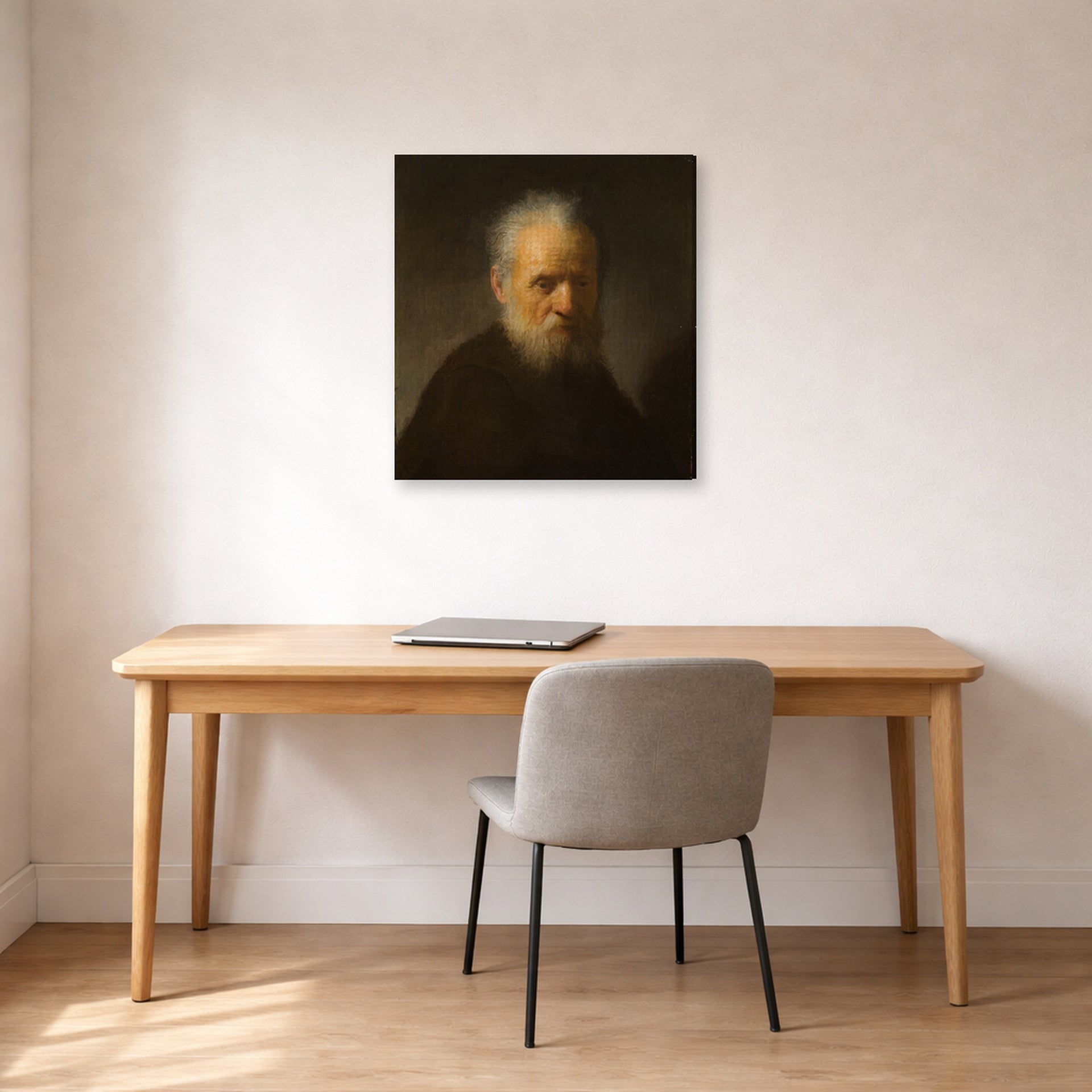Gallery-wrapped canvas print of Rembrandt's Old Man with Beard displayed on a wall in an office