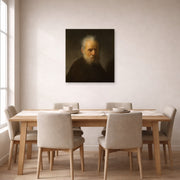 Unframed poster print of Rembrandt's Old Man with Beard displayed on a wall in a dining room
