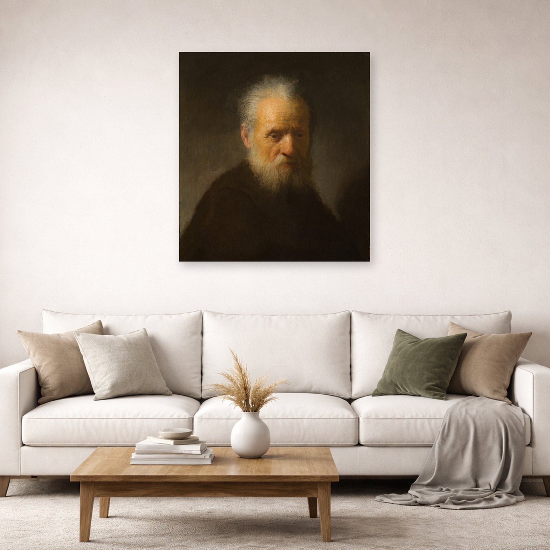 Unframed poster print of Rembrandt's Old Man with Beard displayed on a wall in a living room