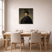 Unframed poster print of Rembrandt's Old Man with a Gold Chain displayed on a wall in a dining room
