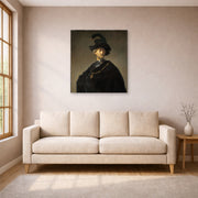 Unframed poster print of Rembrandt's Old Man with a Gold Chain displayed on a wall in a living room