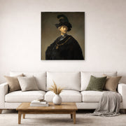 Unframed poster print of Rembrandt's Old Man with a Gold Chain displayed on a wall in a living room