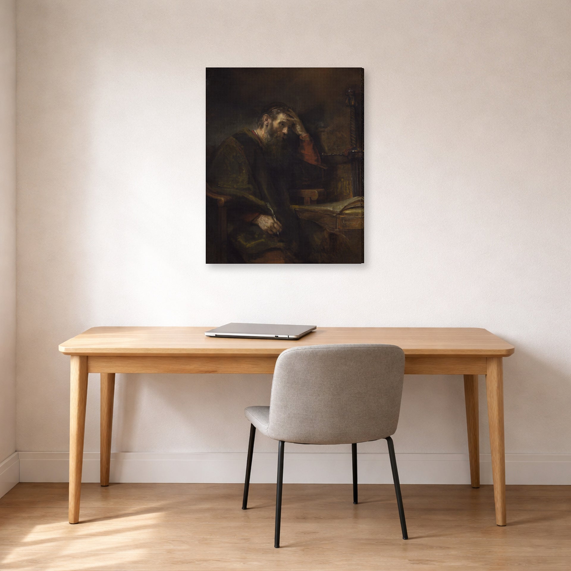Gallery-wrapped canvas print of Rembrandt's Paul the Apostle displayed on a wall in an office