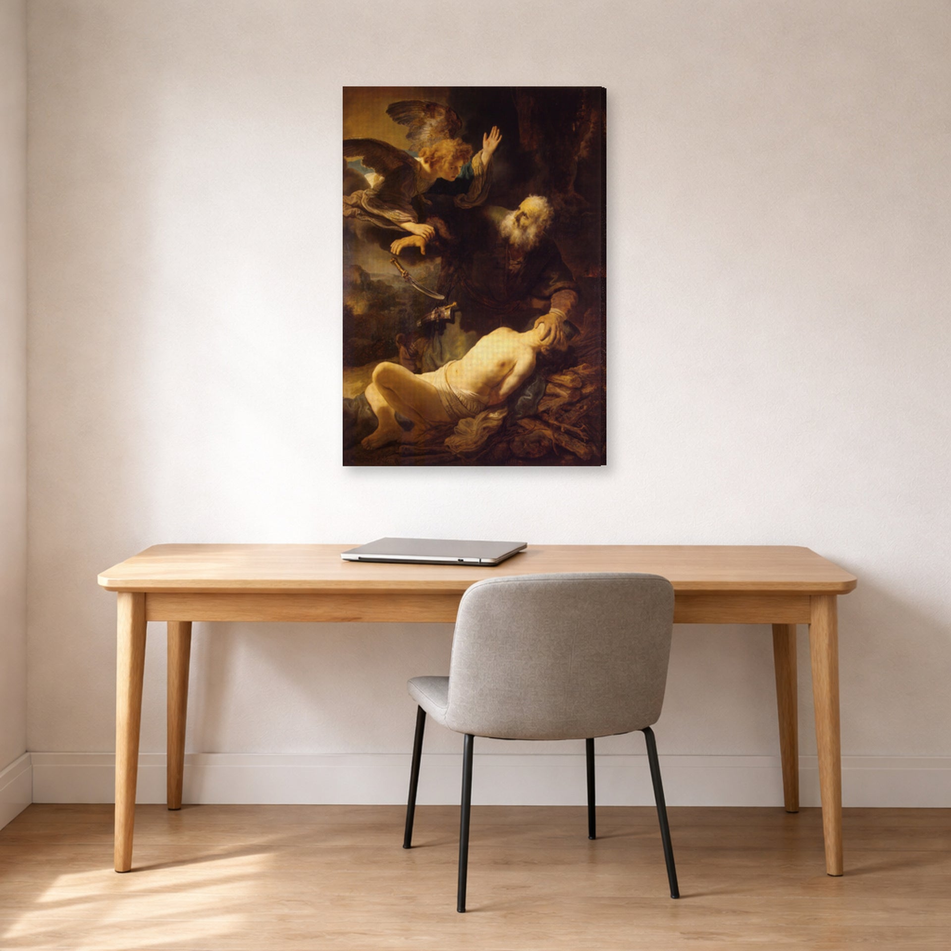 Gallery-wrapped canvas print of Rembrandt's Sacrifice of Isaac displayed on a wall in an office