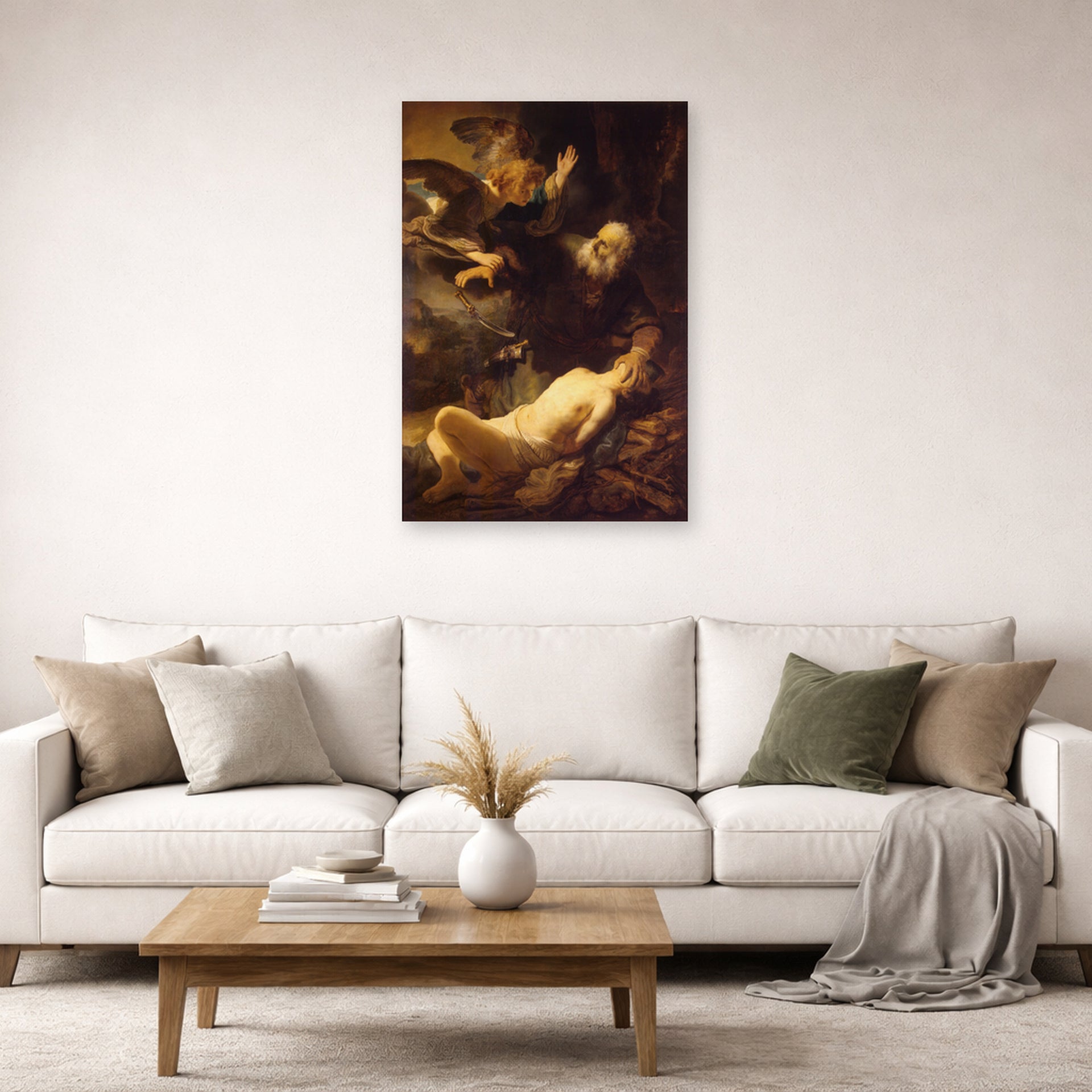 Unframed poster print of Rembrandt's Sacrifice of Isaac displayed on a wall in a living room