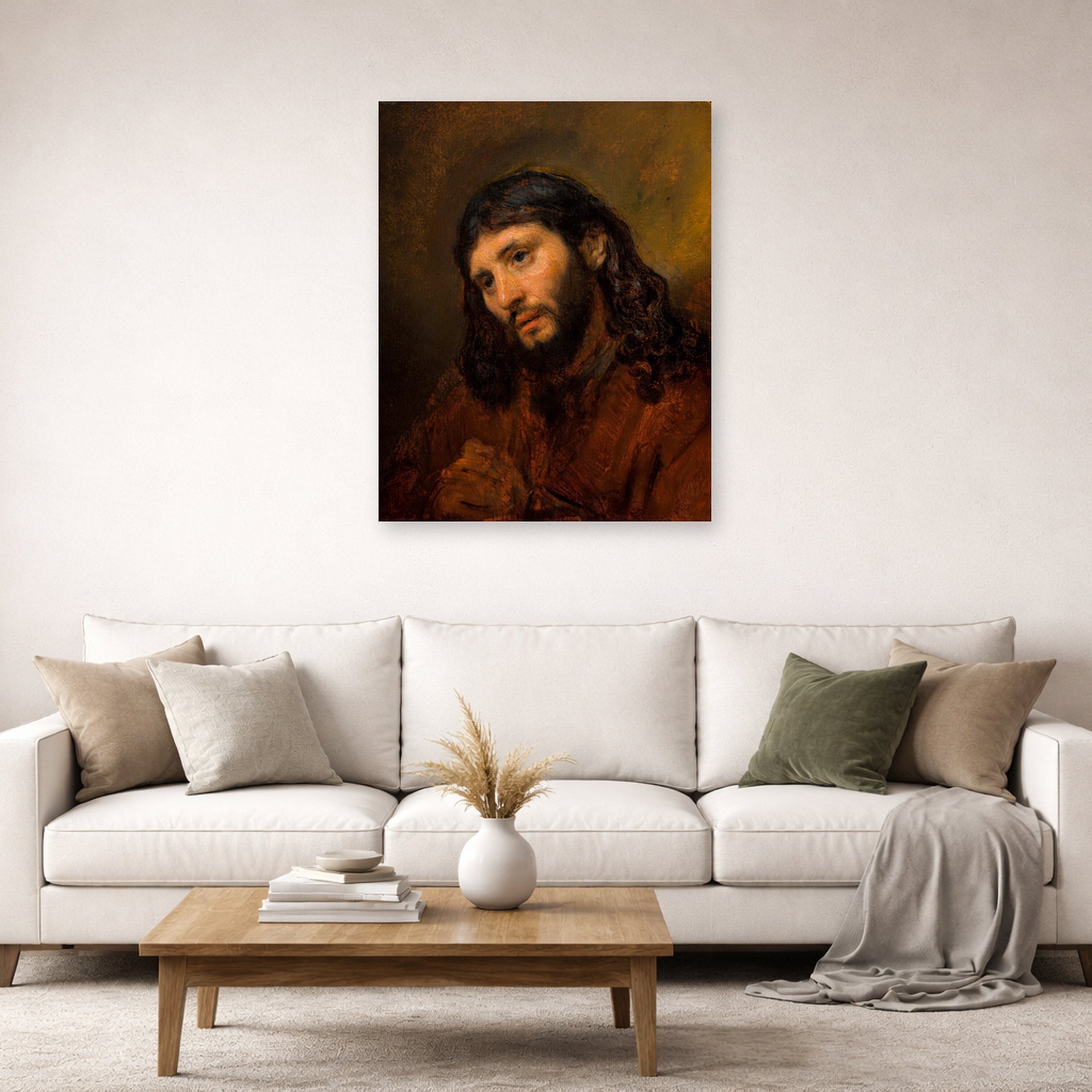 Unframed poster print of Rembrandt's Study for the Head of Young Man displayed on a wall in a living room