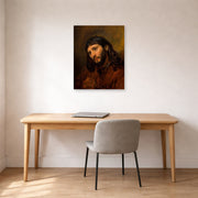 Unframed poster print of Rembrandt's Study for the Head of Young Man displayed on a wall in an office