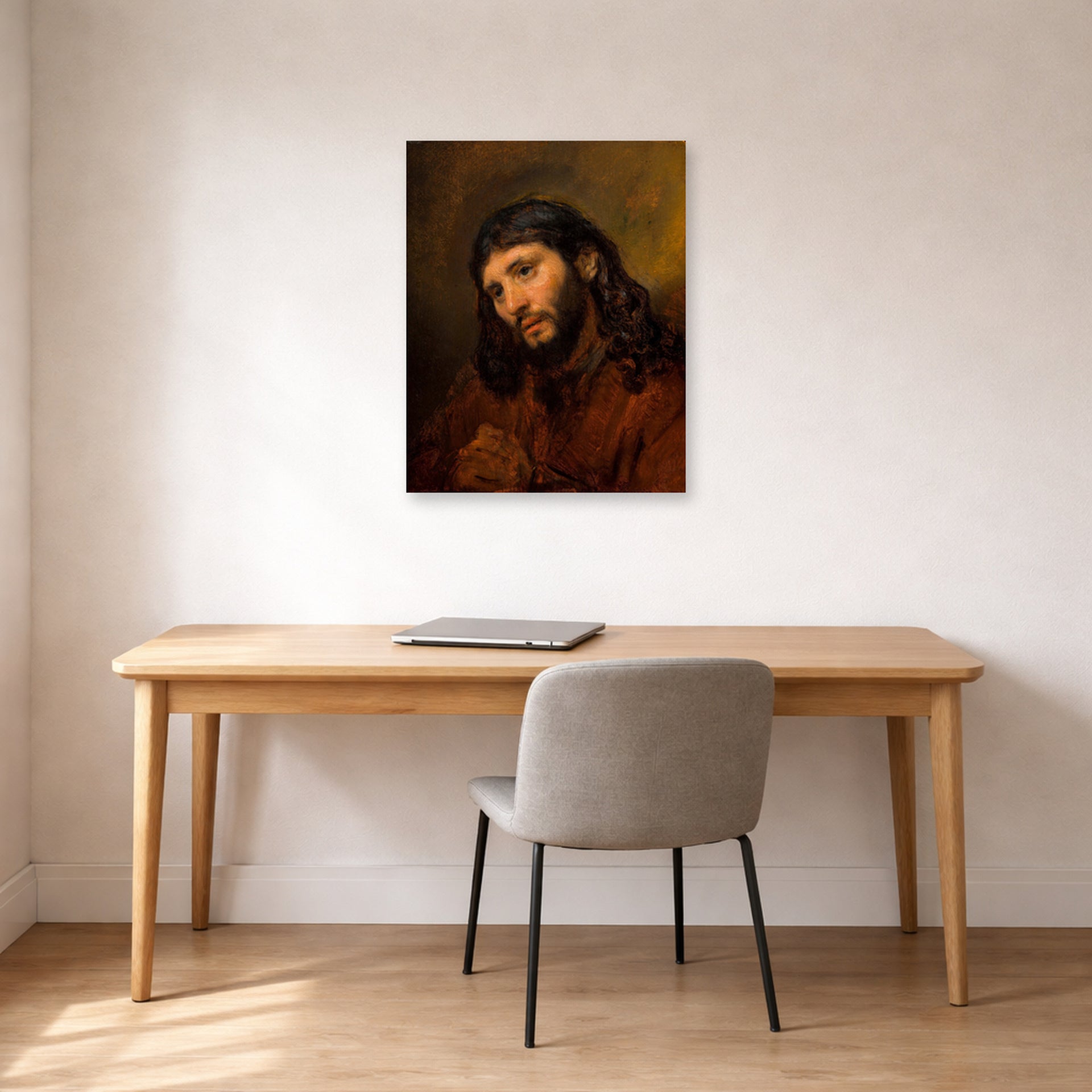 Unframed poster print of Rembrandt's Study for the Head of Young Man displayed on a wall in an office