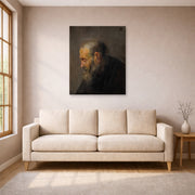 Unframed poster print of Rembrandt's Study of an Old Man in Profile displayed on a wall in a living room