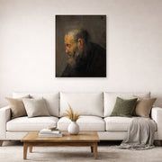 Unframed poster print of Rembrandt's Study of an Old Man in Profile displayed on a wall in a living room