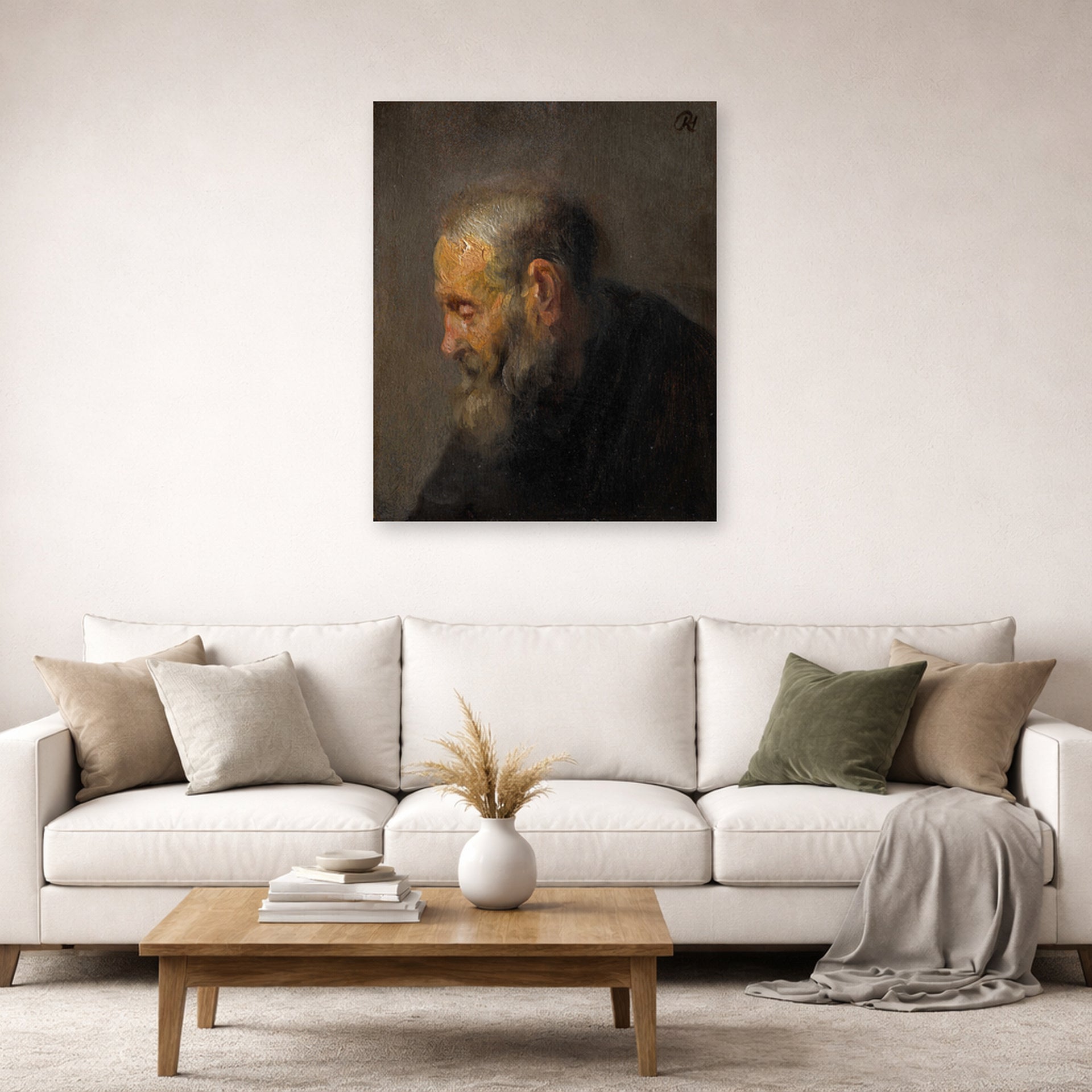 Unframed poster print of Rembrandt's Study of an Old Man in Profile displayed on a wall in a living room
