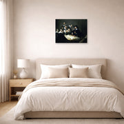 Unframed poster print of Rembrandt's The Anatomy Lesson of Dr. Nicolaes Tulp displayed on a wall in a bedroom