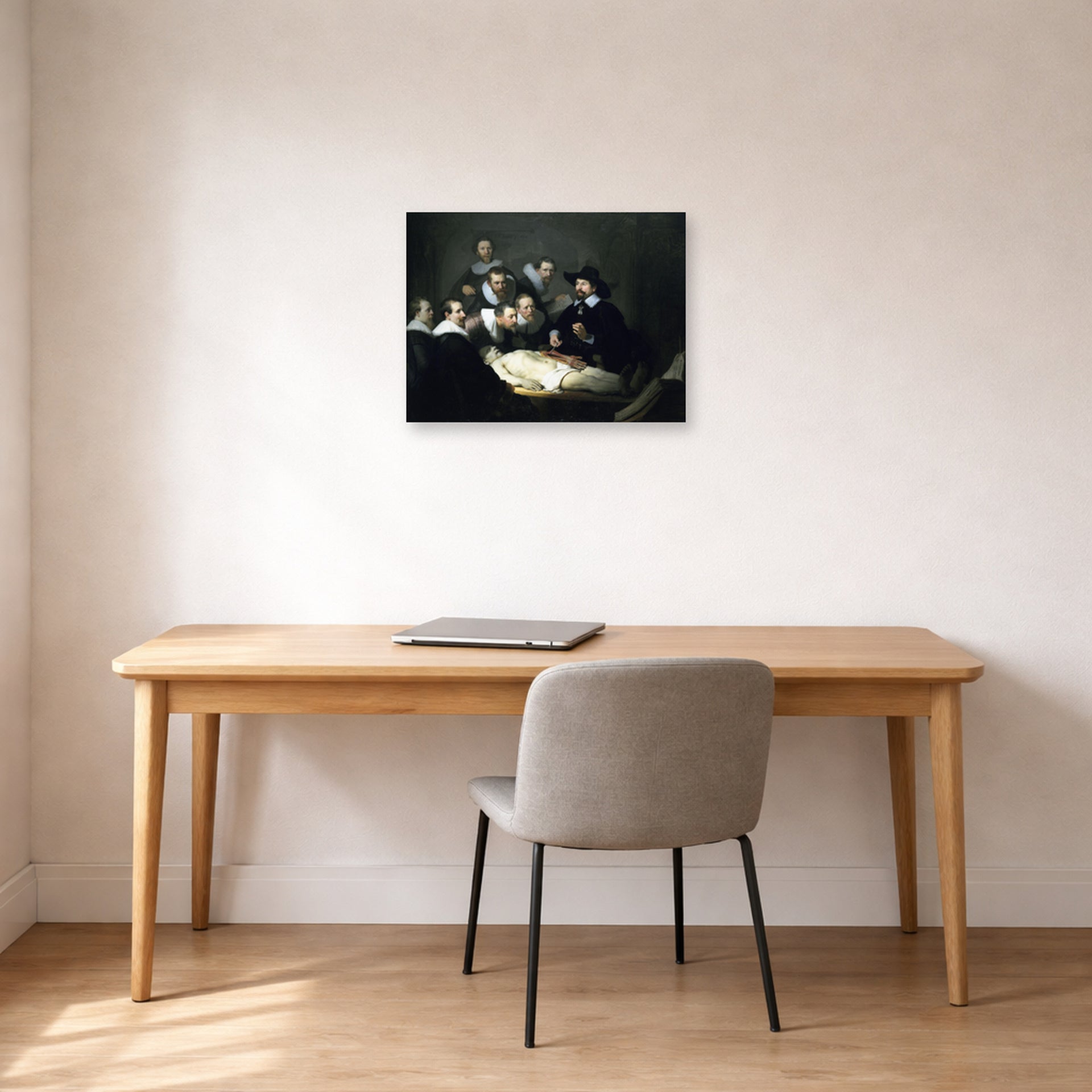Unframed poster print of Rembrandt's The Anatomy Lesson of Dr. Nicolaes Tulp displayed on a wall in an office