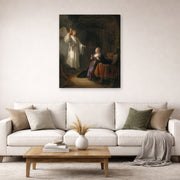 Gallery-wrapped canvas print of Rembrandt's The Annunciation displayed on a wall in a living room