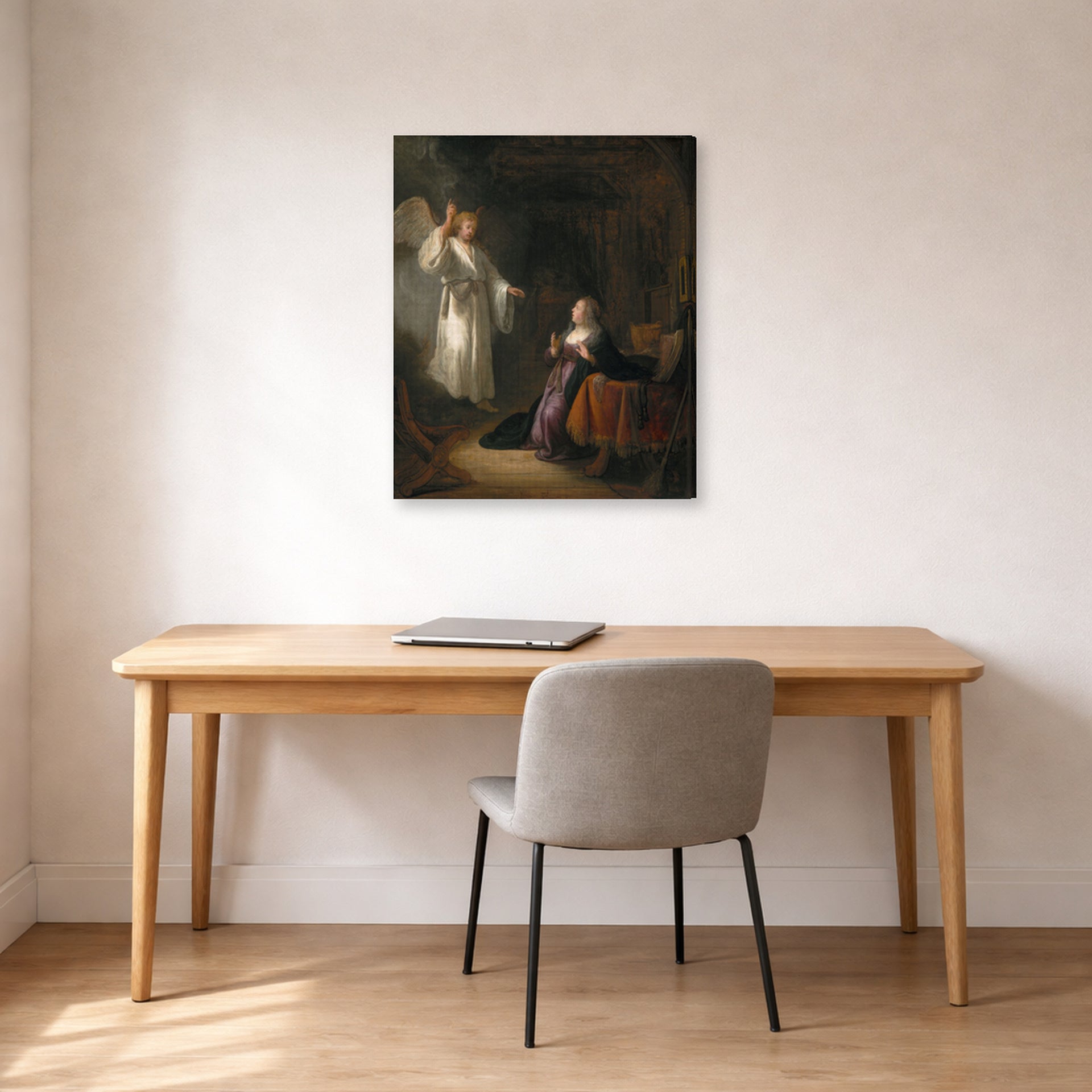 Gallery-wrapped canvas print of Rembrandt's The Annunciation displayed on a wall in an office