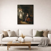 Unframed poster print of Rembrandt's The Annunciation displayed on a wall in a living room