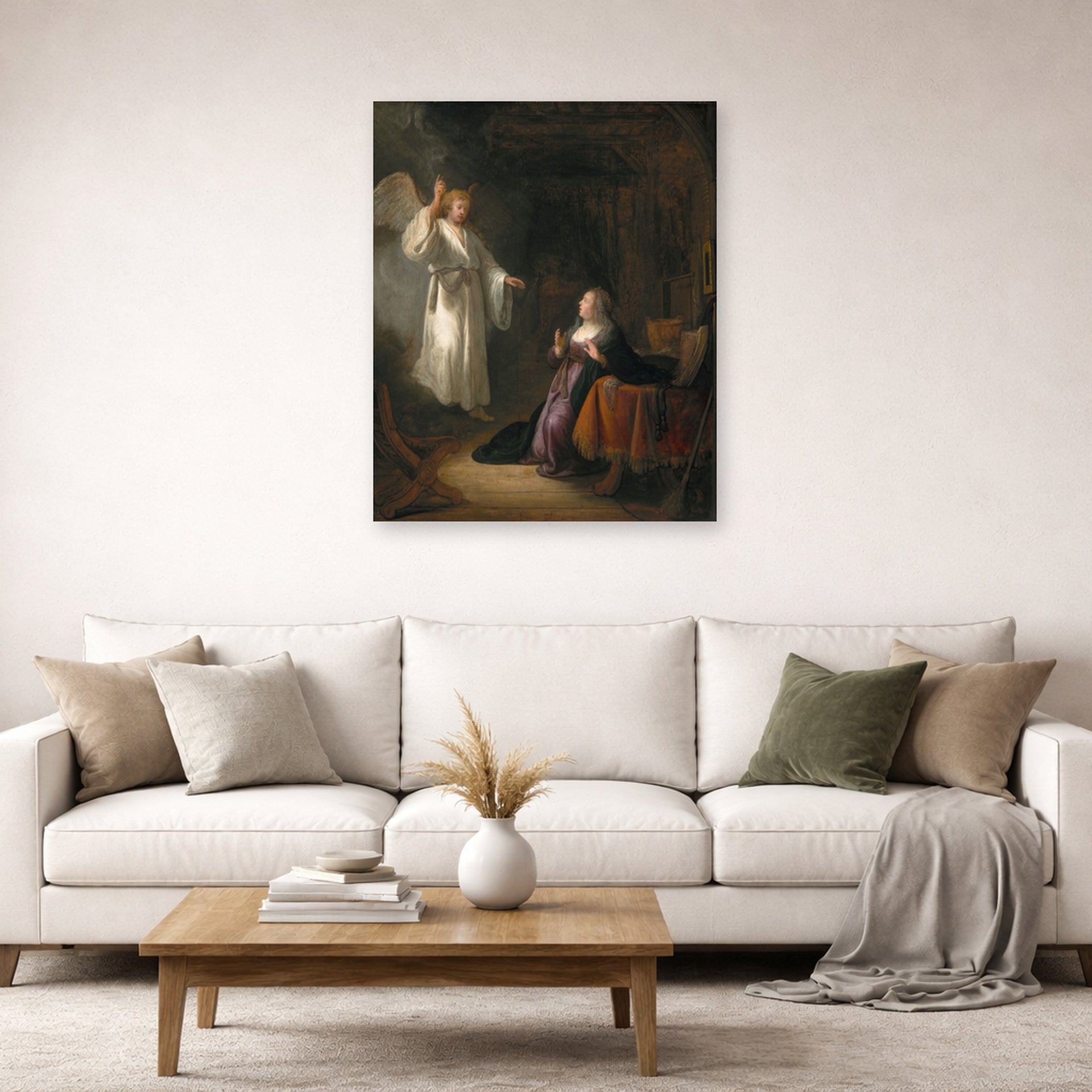 Unframed poster print of Rembrandt's The Annunciation displayed on a wall in a living room
