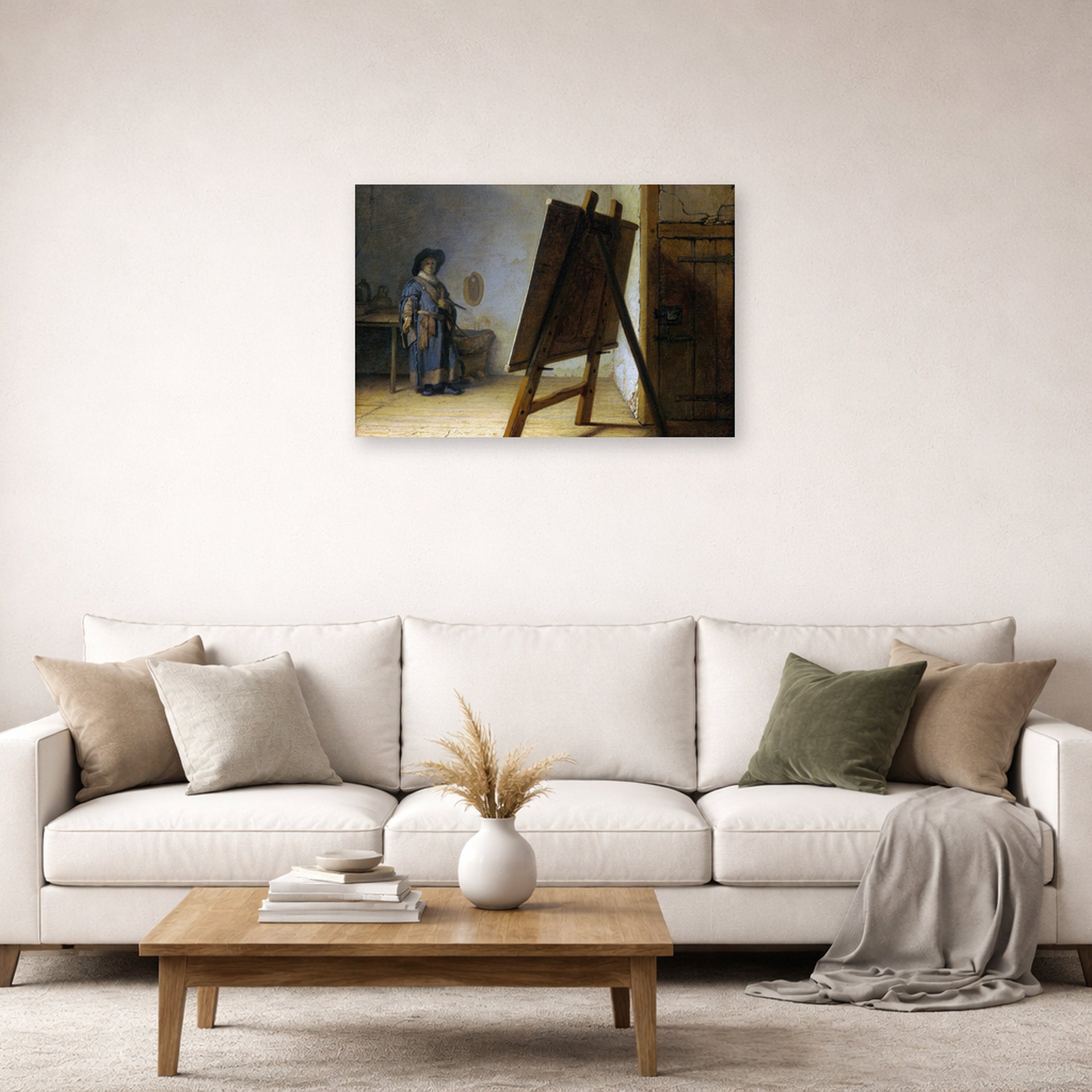 Unframed poster print of Rembrandt's The Artist in his Studio displayed on a wall in a living room