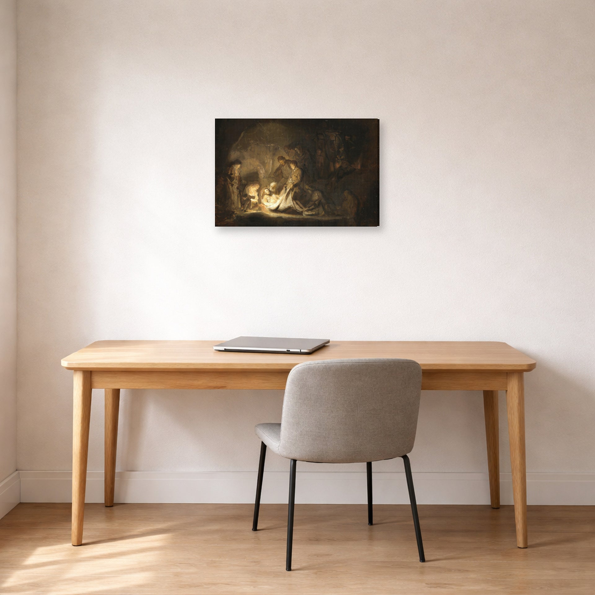 Gallery-wrapped canvas print of Rembrandt's The Entombment displayed on a wall in an office