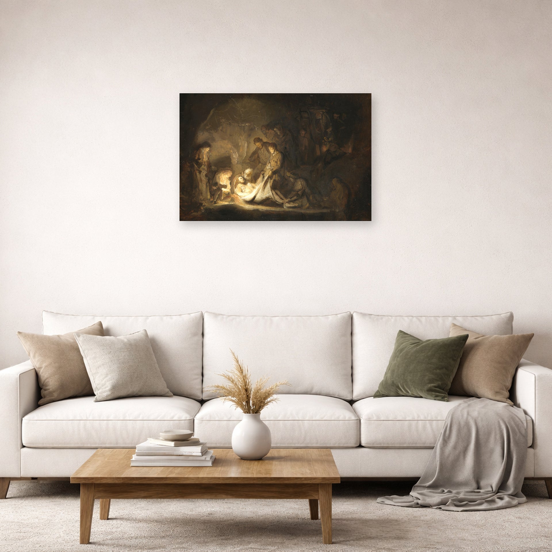 Unframed poster print of Rembrandt's The Entombment displayed on a wall in a living room