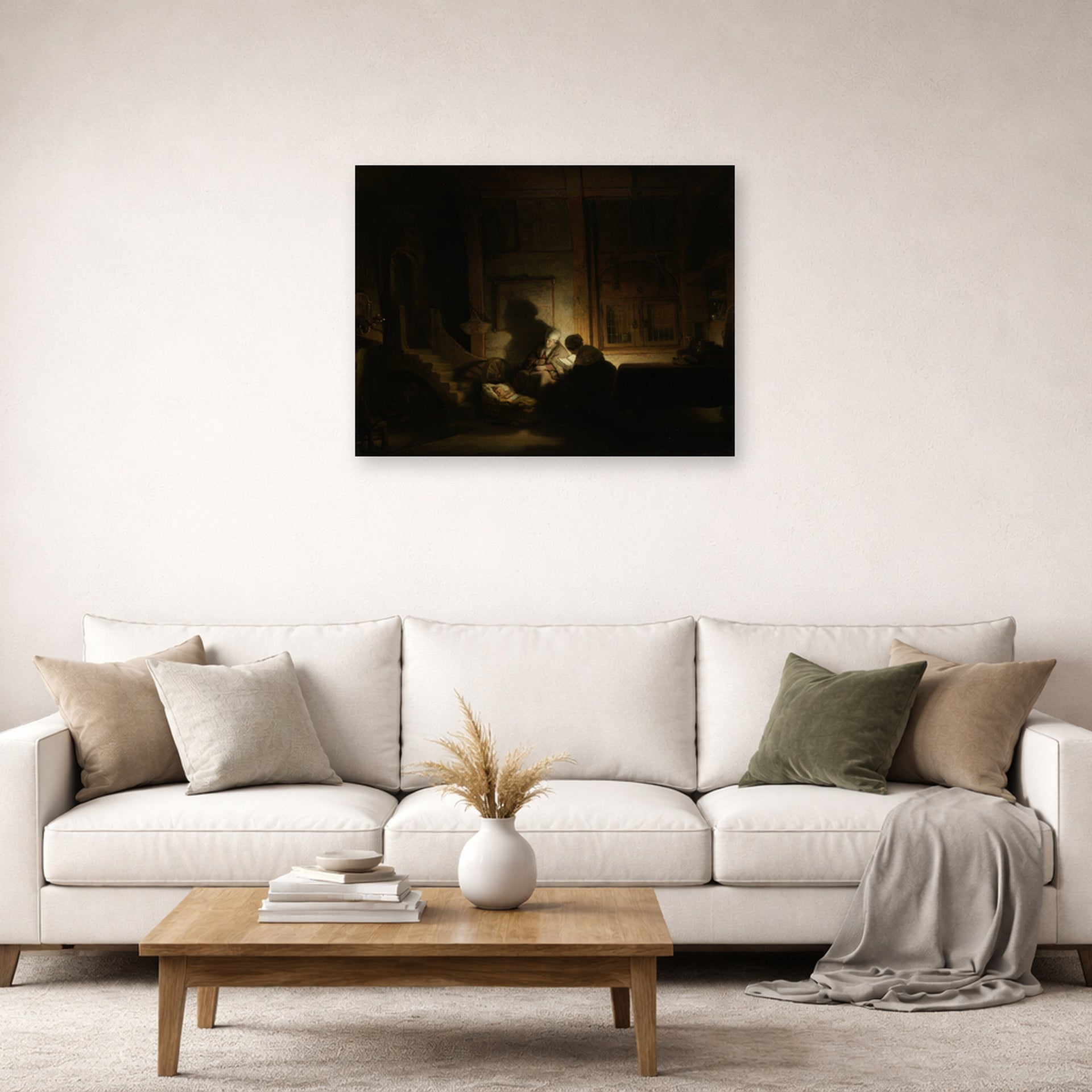 Unframed poster print of Rembrandt's The Holy Family by Night displayed on a wall in a living room