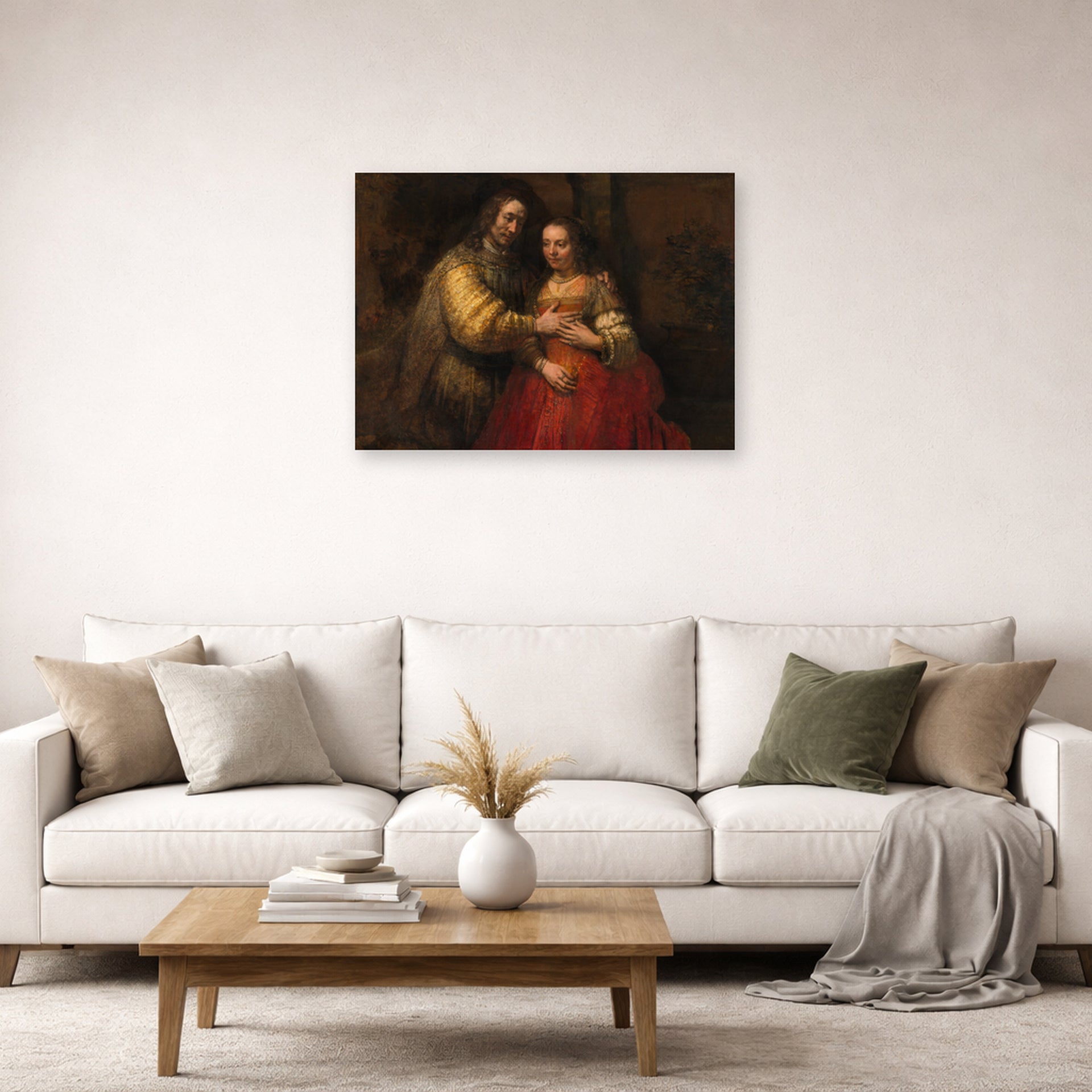 Unframed poster print of Rembrandt's The Jewish Bride displayed on a wall in a living room