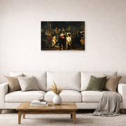 Unframed poster print of Rembrandt's The Night Watch displayed on a wall in a living room