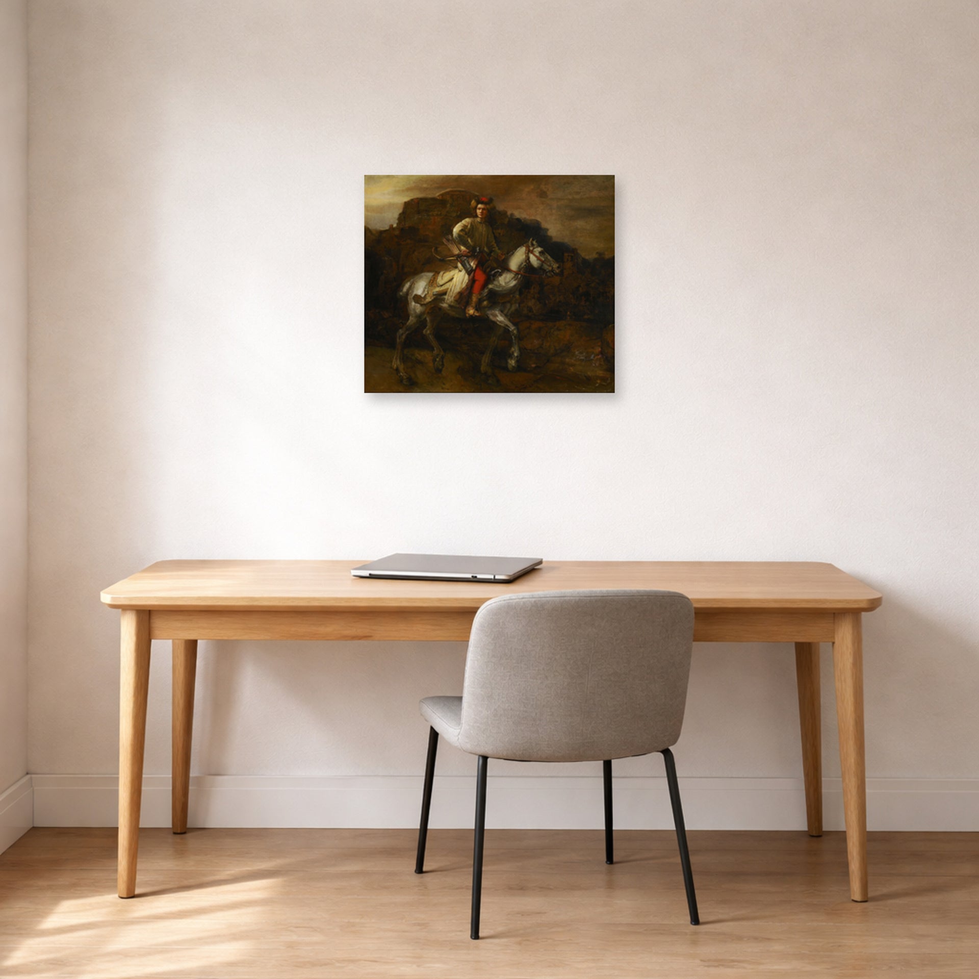 Unframed poster print of Rembrandt's The Polish Rider displayed on a wall in an office