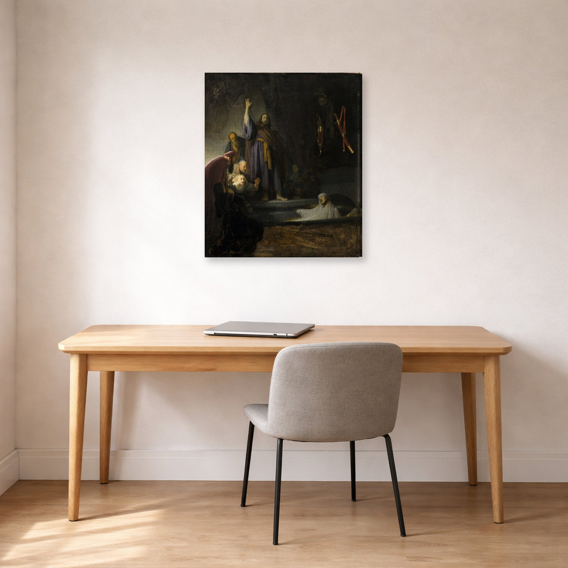 Gallery-wrapped canvas print of Rembrandt's The Raising of Lazarus displayed on a wall in an office